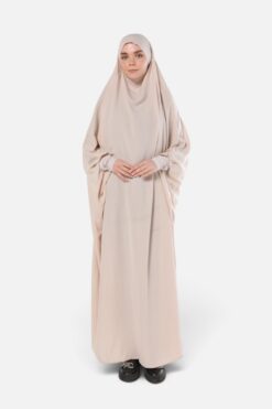 Wholesale Jilbab Medina Silk — cream one-piece prayer jilbab with integrated khimar on model