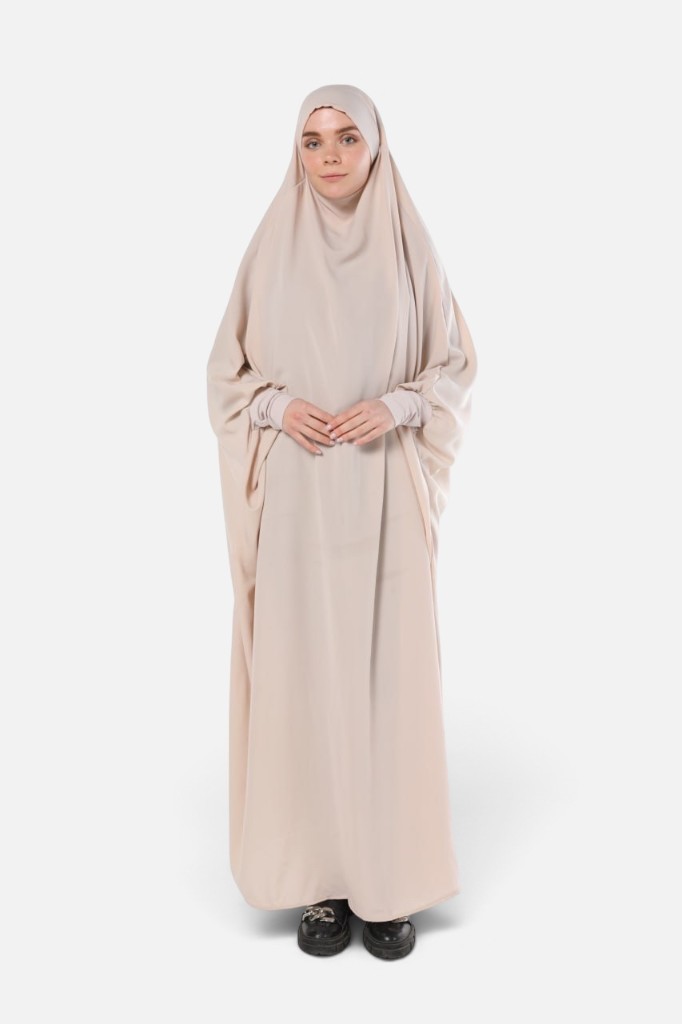 Wholesale Jilbab Medina Silk — cream one-piece prayer jilbab with integrated khimar on model